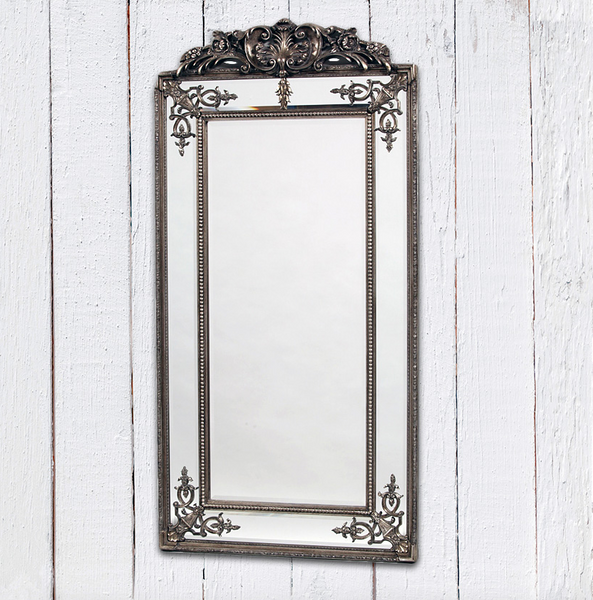 Tall crested silver French wall mirror