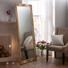 Traditional ornate tall slim rectangular salon wall mirror.
