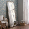 Traditional ornate tall slim rectangular salon wall mirror.